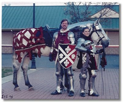 Spanish-Norman stallion Rom�ntico H.H.F. shown with rider Amber Talarico and armor-maker Jeff Mann after a performance at Equine Affaire 1998 in W. Springfield, Massachusetts.